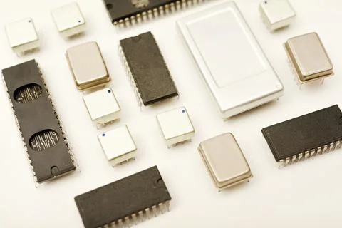 Old chips on a white background. Electronic components. Processors in metal.. Stock Photos