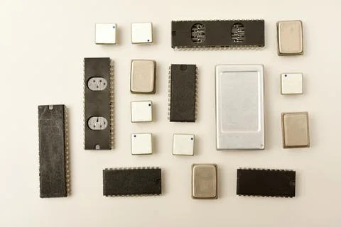 Old chips on a white background. Electronic components. Processors in metal.. Stock Photos