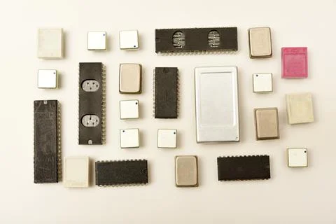 Old chips on a white background. Electronic components. Processors in metal.. Stock Photos
