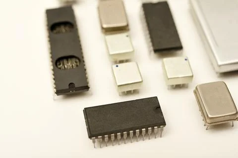 Old chips on a white background. Electronic components. Processors in metal.. Stock Photos