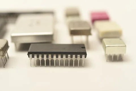 Old chips on a white background. Electronic components. Processors in metal.. Stock Photos