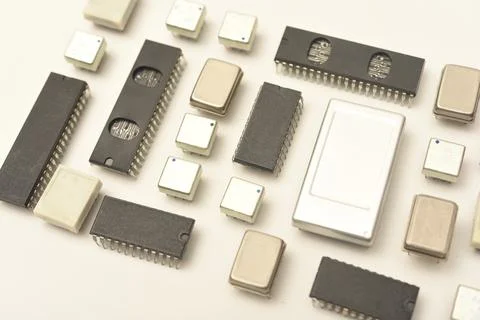 Old chips on a white background. Electronic components. Processors in metal.. Stock Photos