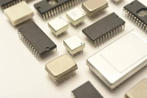 Old chips on a white background. Electronic components. Processors in metal.. Foto stock
