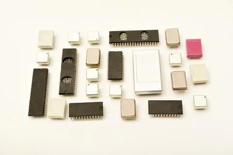 Old chips on a white background. Electronic components. Processors in metal.. Stock Photos
