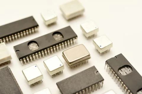 Old chips on a white background. Electronic components. Processors in metal.. Stock Photos