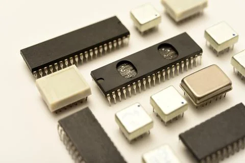 Old chips on a white background. Electronic components. Processors in metal.. Stock Photos
