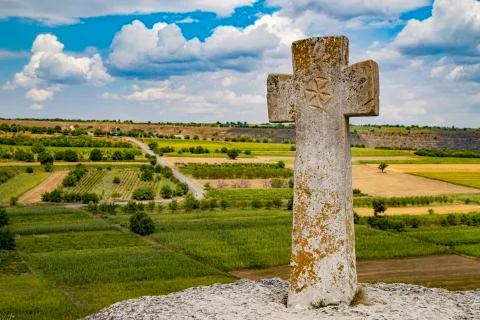 Old christian cross above the historical temple complex of old Orhei. Stock Photos