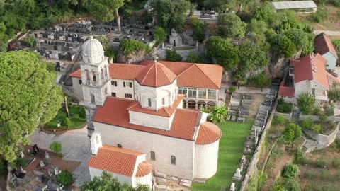 Old Christian monastery surrounded by green park and garden of Savina abbey Stock Footage 160140299