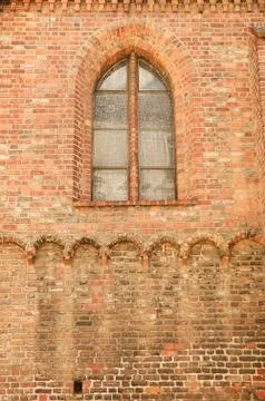 Old church brick wall and window - background Stock Photos