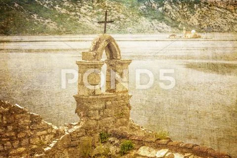 The old church overlooking the sea in bad weather Stock Photos