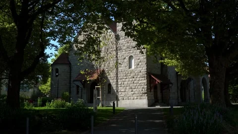 An old church surrounded by trees and the bells ringing loudly Video stock 313328199