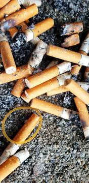 Old cigarettes filter in ashtray Stock Photos