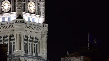 Old City Hall Clock Tower at Night - Waving Blue Government Flag Video stock 85496753