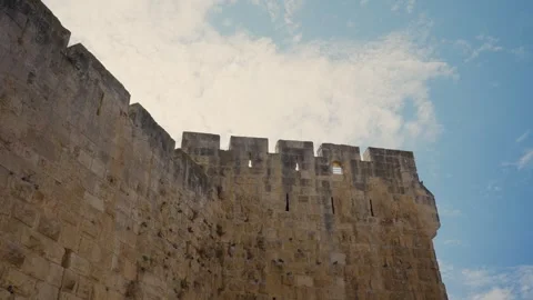 Old City of Jerusalem ancient stone wall rampart against the blue sky 動画素材 339205699