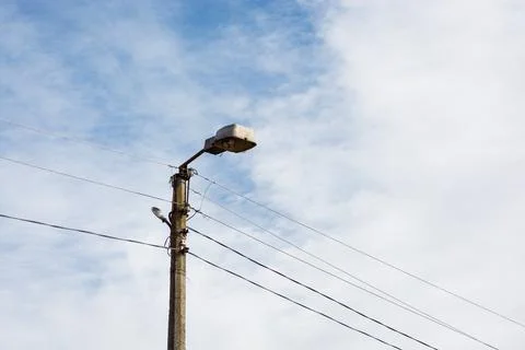 Old city lantern on a background of sky and clouds during the day Stock Photos