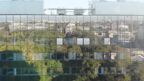 Old city reflection in the glass windows of business center building Stock Footage 155651488