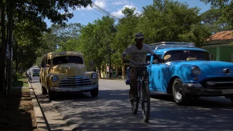 Old classic American 1950's vintage car drive in rural town Vinales valley Cuba Stock Footage