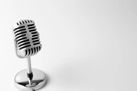 Old classic microphone on plain background Stock Photos