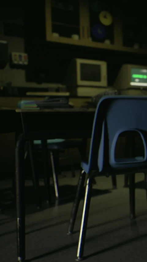 Old classroom with empty chair and computer at night time Stock Footage 332232518