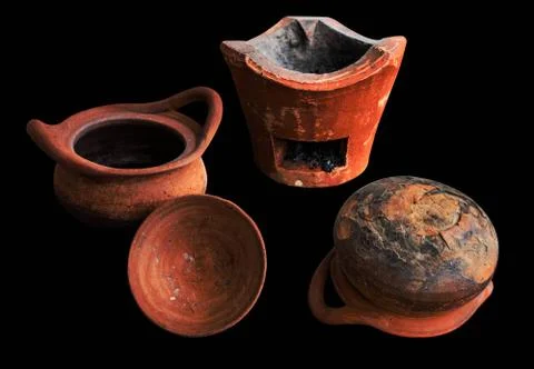 Old clay pot on black background. 스톡 사진