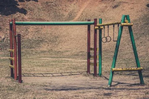 Old climbing frame on rusty old playground in outdoor park Stock Photos