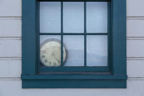 Old Clock behind Window Stock Photos