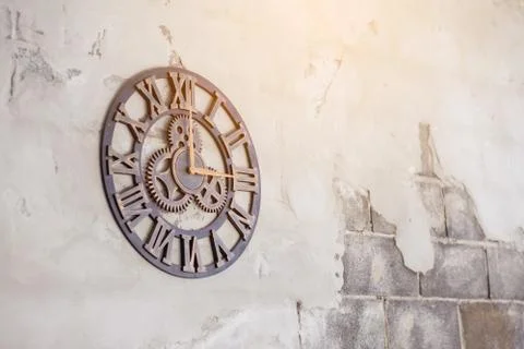 Old clock on the cement ground Stock Photos