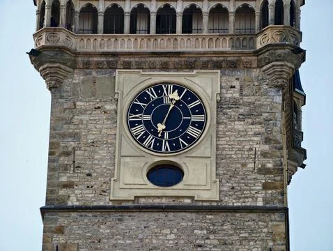 Old clock with decorative face. Landmark structure featuring weathered ston.. Stock Photos