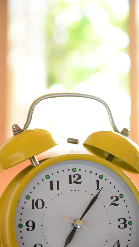 Old clock ringing on desk at home Stock Footage 157555352