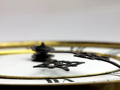 Old clock with roman numerals. Stock Photos