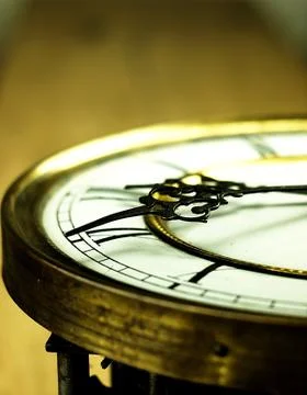 Old clock with roman numerals. Stock Photos