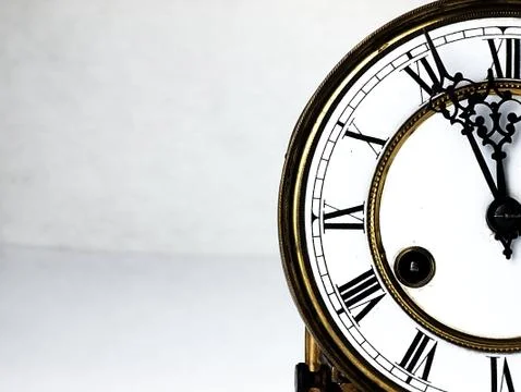 Old clock with roman numerals. Stock Photos