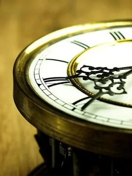 Old clock with roman numerals. Stock Photos