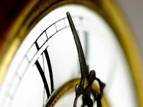 Old clock with roman numerals. Stock Photos