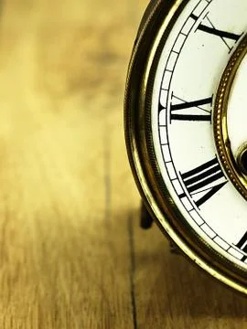 Old clock with roman numerals. Stock Photos
