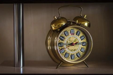 Old clock on the shelf Stock Photos