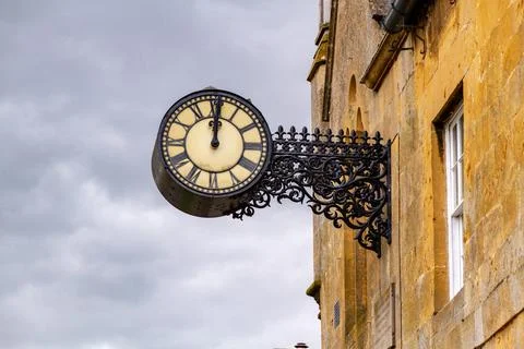 An old clock on a stone wall Foto stock