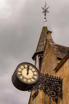 An old clock on a stone wall Stock Photos