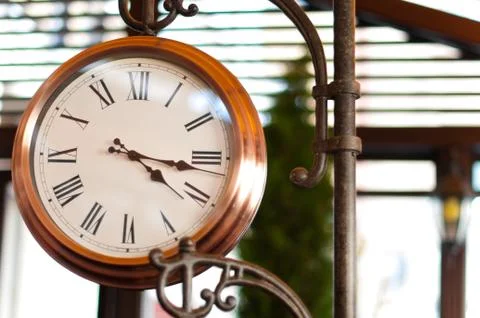 Old clock in the street Stock Photos