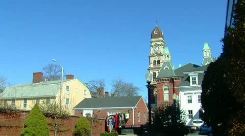 Old Clock Tower Against Bright Blue Sky wide shot Stock Footage 10864210