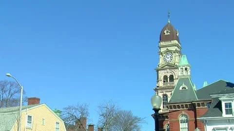 Old Clock Tower Against Bright Blue Sky_medium shot Stock Footage 10864227