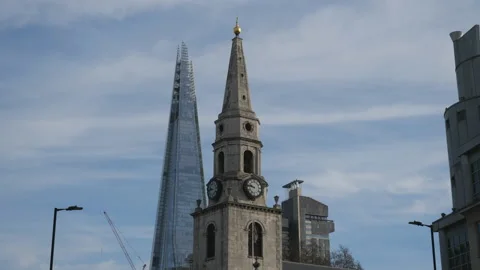 An old clock tower and pointy modern building. Stock Footage 146723344