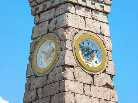 Old clock tower with new clock mechanism, close-up Stock Photos
