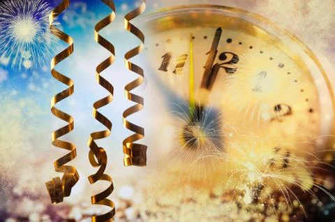 Old clock at twelve o'cklock on holiday fireworks background - New Year's Foto stock