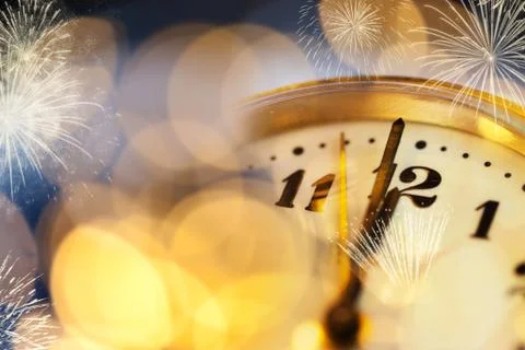 Old clock at twelve o'cklock on holiday fireworks background - New Year's Stock Photos