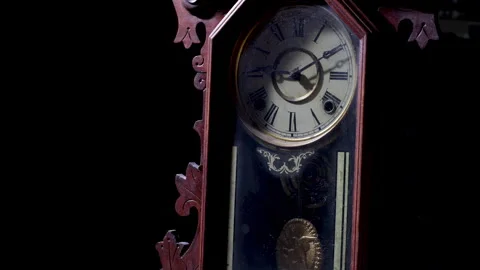 Old clock vintage clock close up. Pendulum clock with wooden frame. Stock Footage 273533786