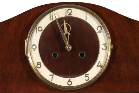 Old clock on a white wall. close up. Stock Photos