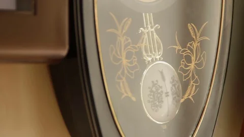 Old clocks. The pendulum moves Video stock 74634747