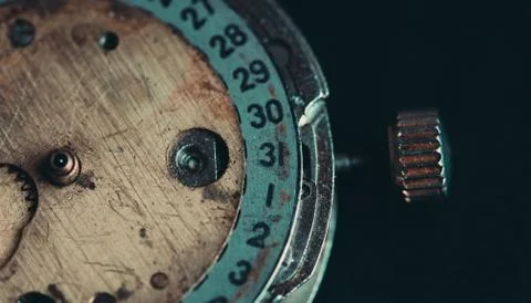 Old clockwork mechanism in close-up. Selective focus on macro details. Light  Stock Photos