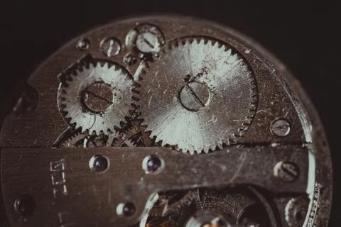 Old clockwork mechanism in close-up. Selective focus on macro details. Light  Stock Photos